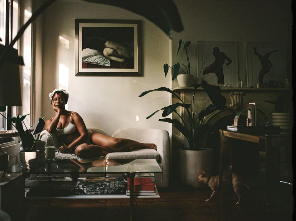The photographer Dana Scruggs at home. Her self-portrait is part of the collection “Sources of Self-Regard: Self-Portraits From Black Photographers Reflecting on America.”Credit...Dana Scruggs for The New York Times